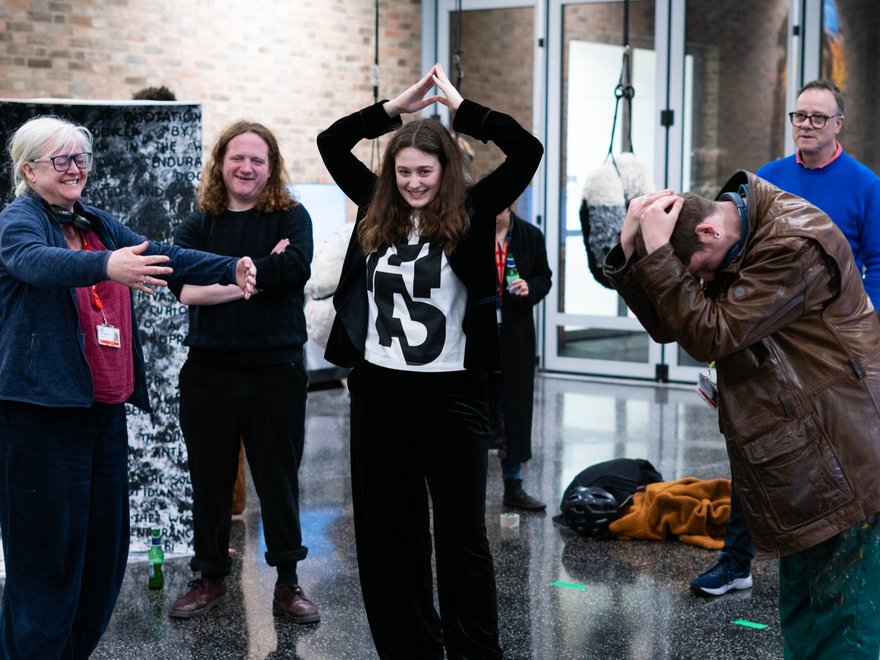 A performance with several adults