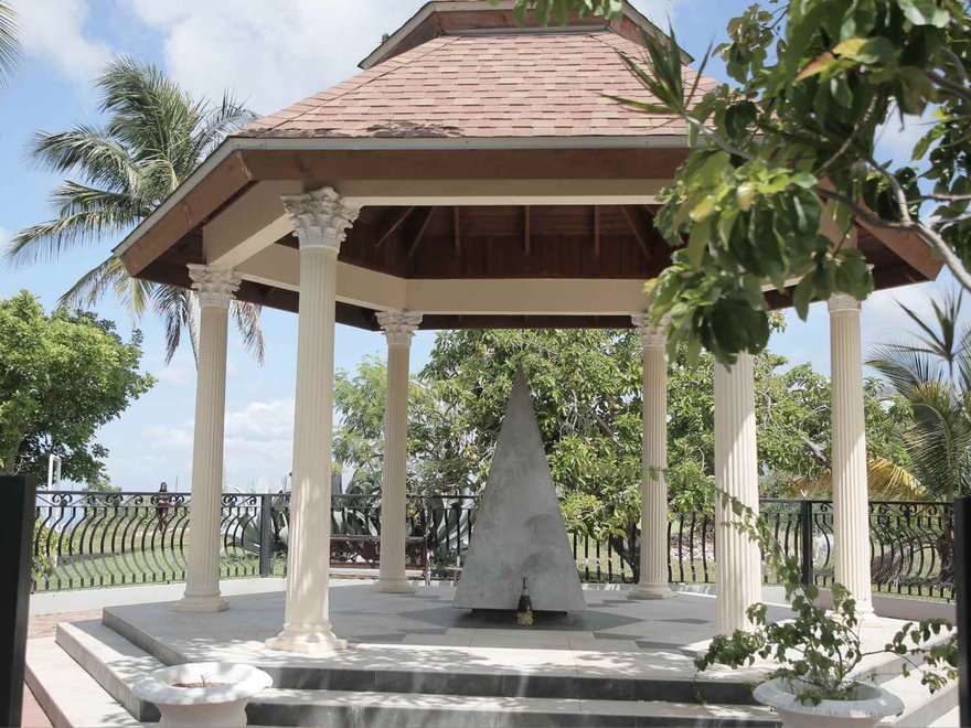 Memorial and final resting place showing a small marble hut with steps