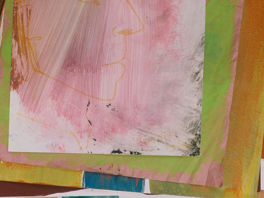 a collection of watercolour paintings in a pile